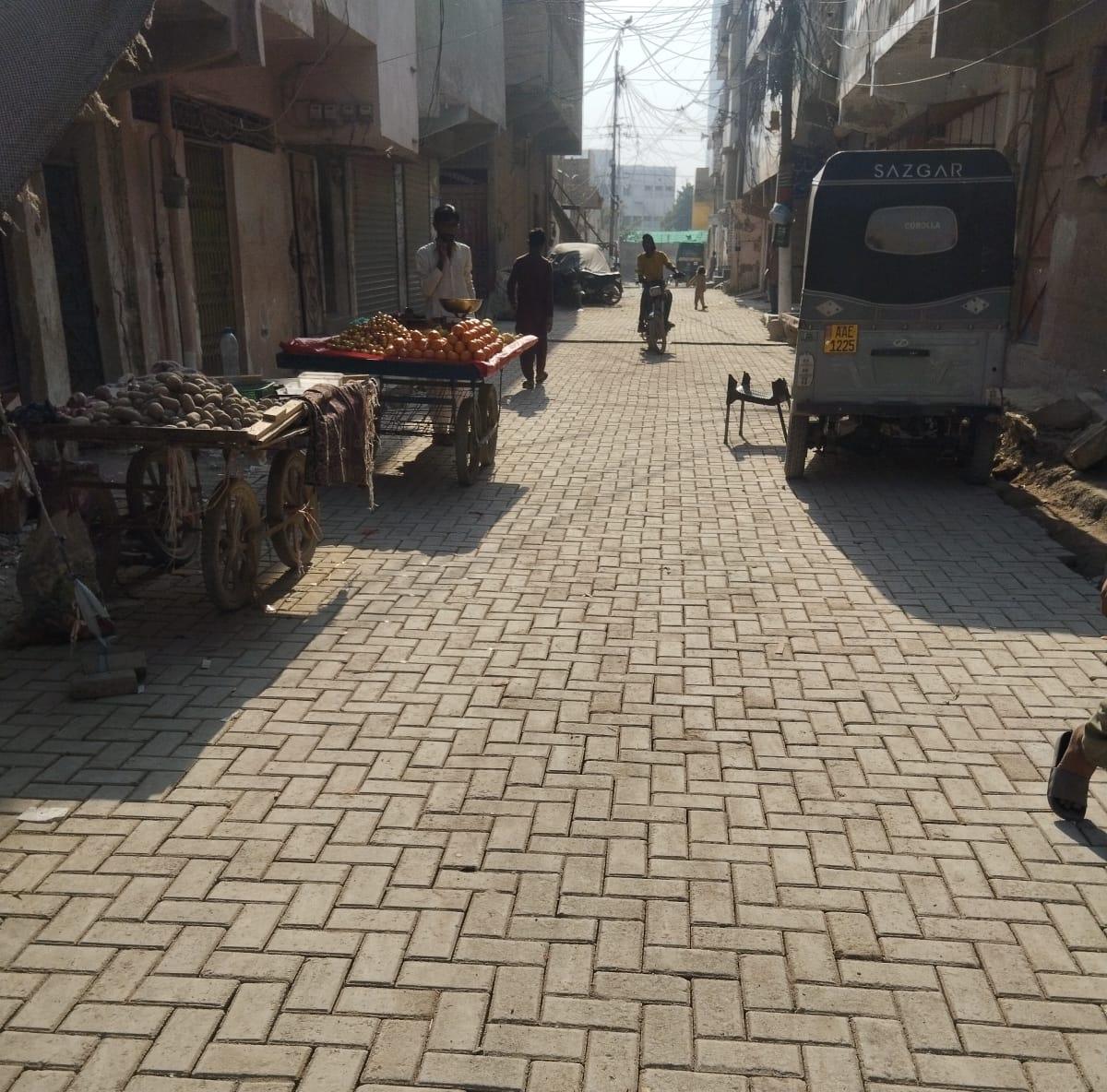 Freshly laid paver-block street with market stalls